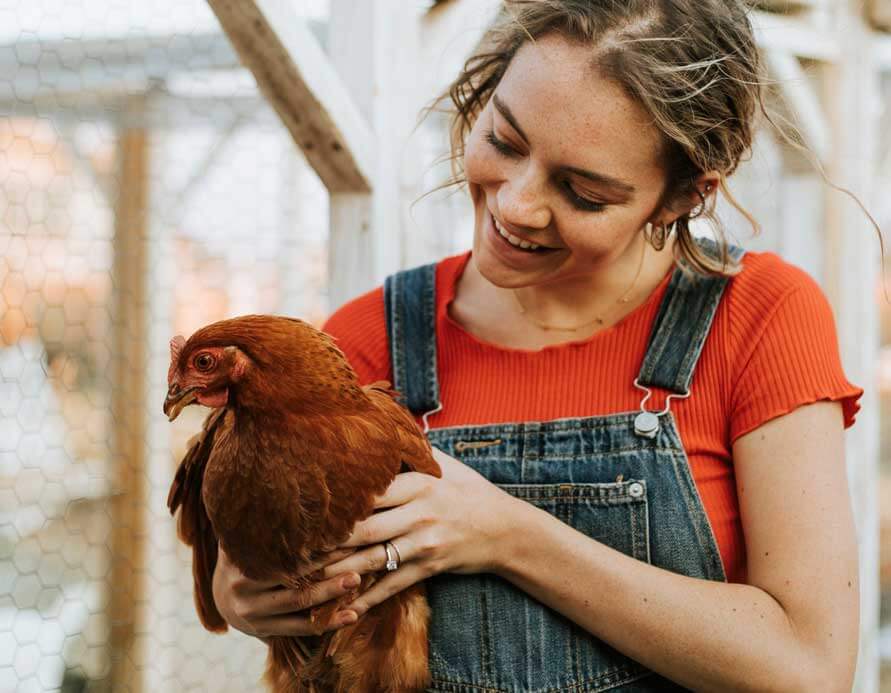 Woman holding chicken