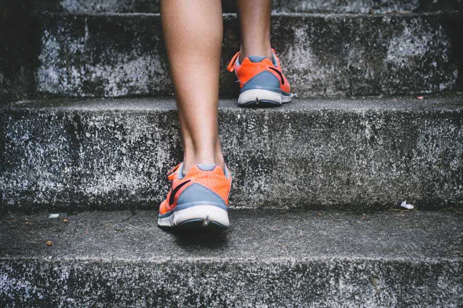 woman running up stairs, exercise