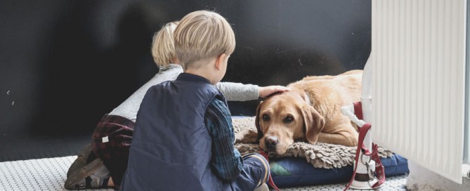 kids and pet dog sitting on the floor