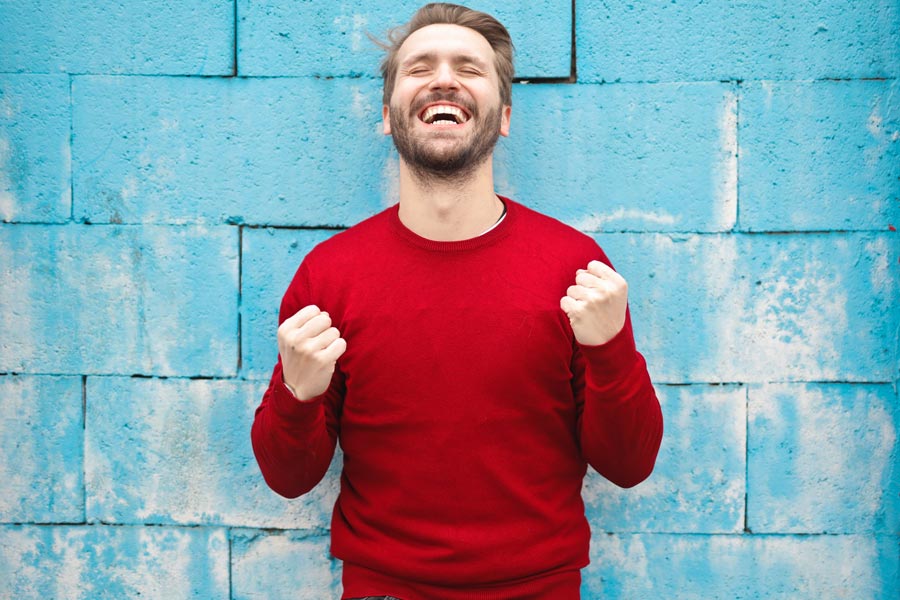 Happy man wearing red jumper