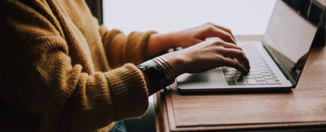 woman typing on computer, pet business