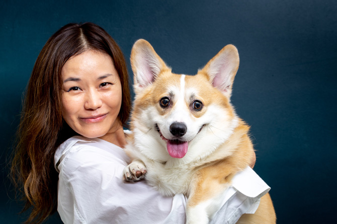 woman holding corgi, Vets play a vital role in both animal and human health, discover how. Plus, get 7 fun veterinary facts to celebrate World Veterinary Day.