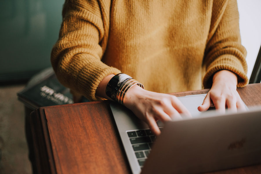 woman on laptop, pet business insurance