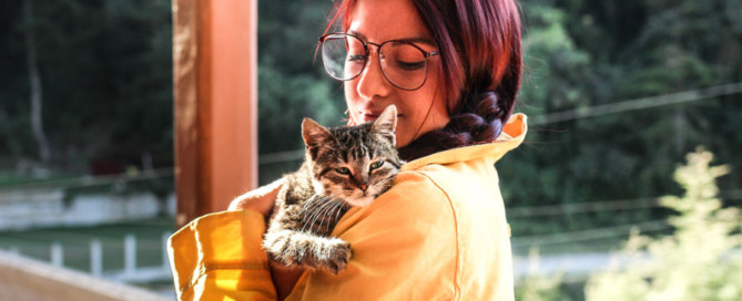 woman holding a cat, pet sitters